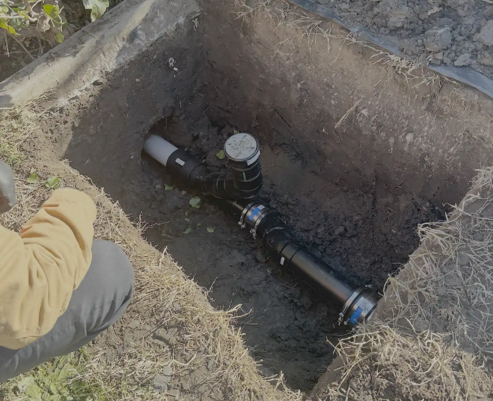 New sewer lateral pipe and cleanout fitting set in an open excavation during a private lateral replacement